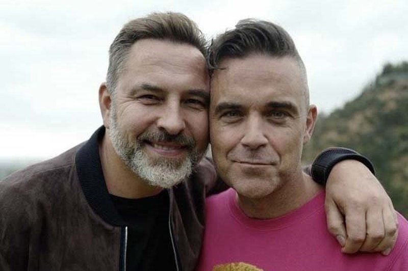 Robbie Williams bo sodeloval pri muzikalu po knjigi Davida Walliamsa (foto: profimedia)