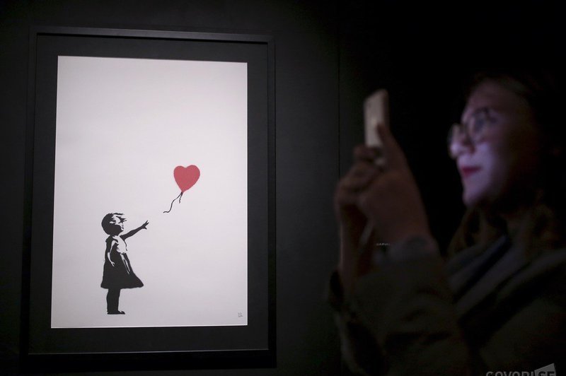 Lastnica deloma samouničene Banksyjeve slike bo nakup izvedla do konca (foto: Profimedia)
